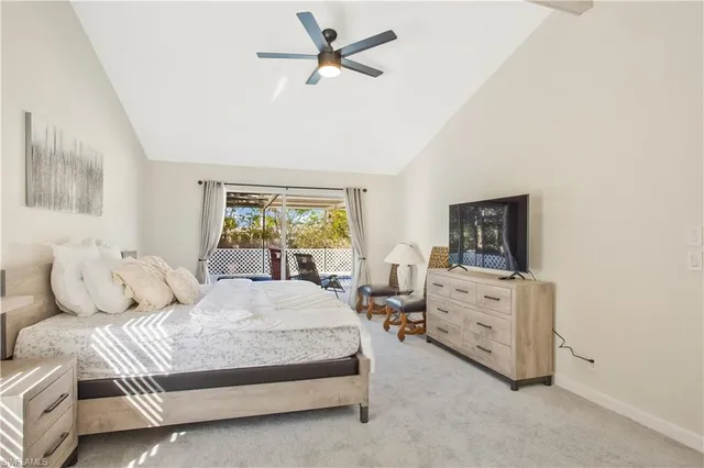 a bedroom with a bed and ceiling fan