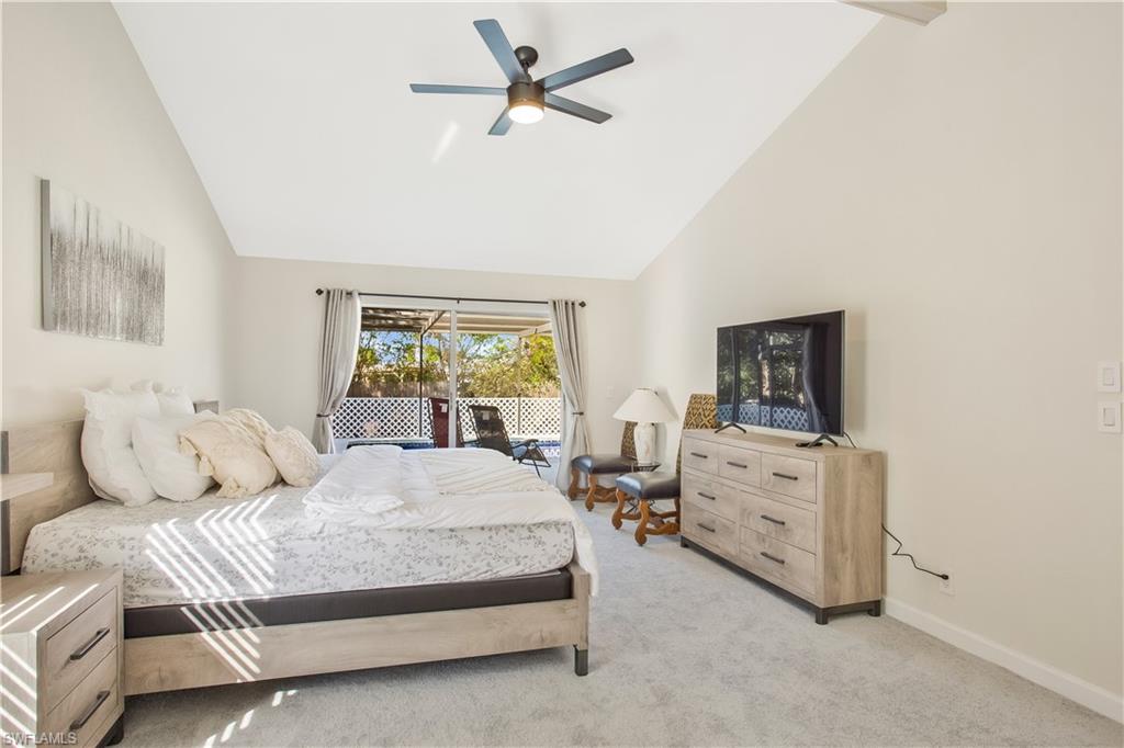1039 Cardinal Street Naples, FL 34104 - Photo 17 of 29 a bedroom with a bed and ceiling fan
