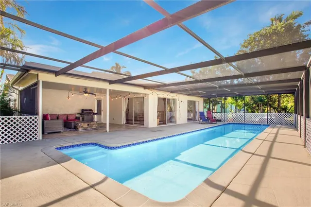 a front view of a house with swing and slide