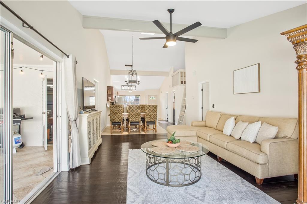 1039 Cardinal Street Naples, FL 34104 - Photo 6 of 29 a living room with furniture and a large window