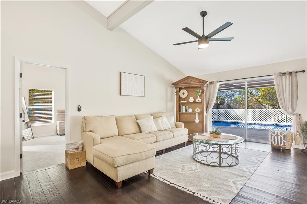 1039 Cardinal Street Naples, FL 34104 - Photo 7 of 29 a living room with furniture and a large window