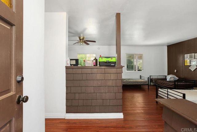 a kitchen with a sink and a stove top oven