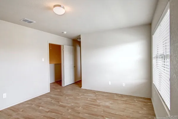 a view of an empty room and window