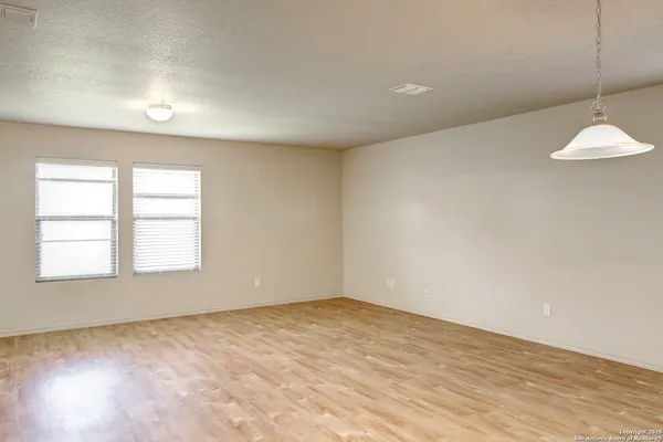 an empty room with a empty space and a window