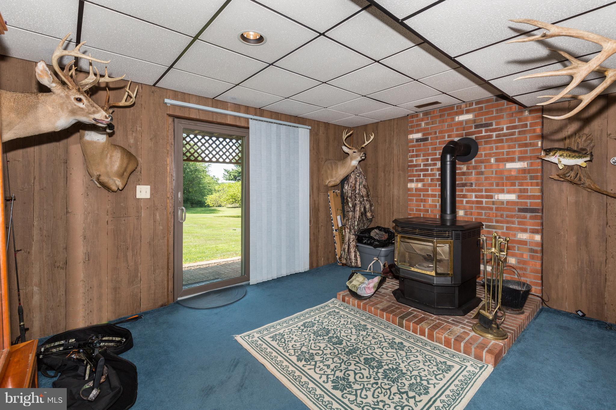 1307 Stone Road Westminster, MD 21158 - Photo 27 of 30 Family Room with pellet stove and slider