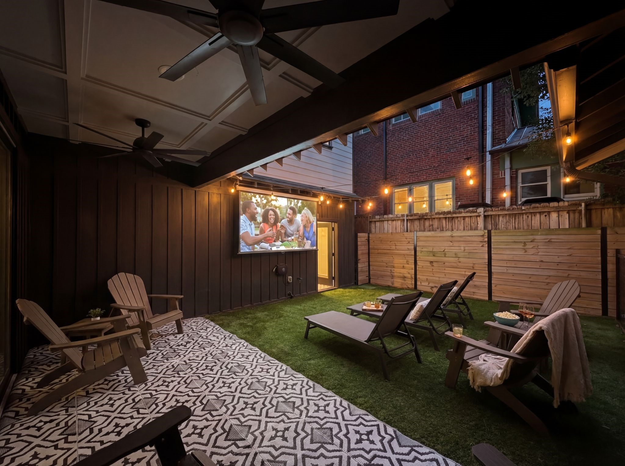 2626 Reagan Street Houston, TX 77009 - Photo 43 of 50 43. The covered patio creates an inviting outdoor lounge space complete with string lighting, and a ceiling fan, while a pull-down projector screen transforms the area into the perfect setting for outdoor movie nights or watching the big game with friends and family.