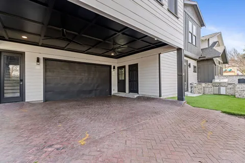 an aerial view of a house with outdoor space