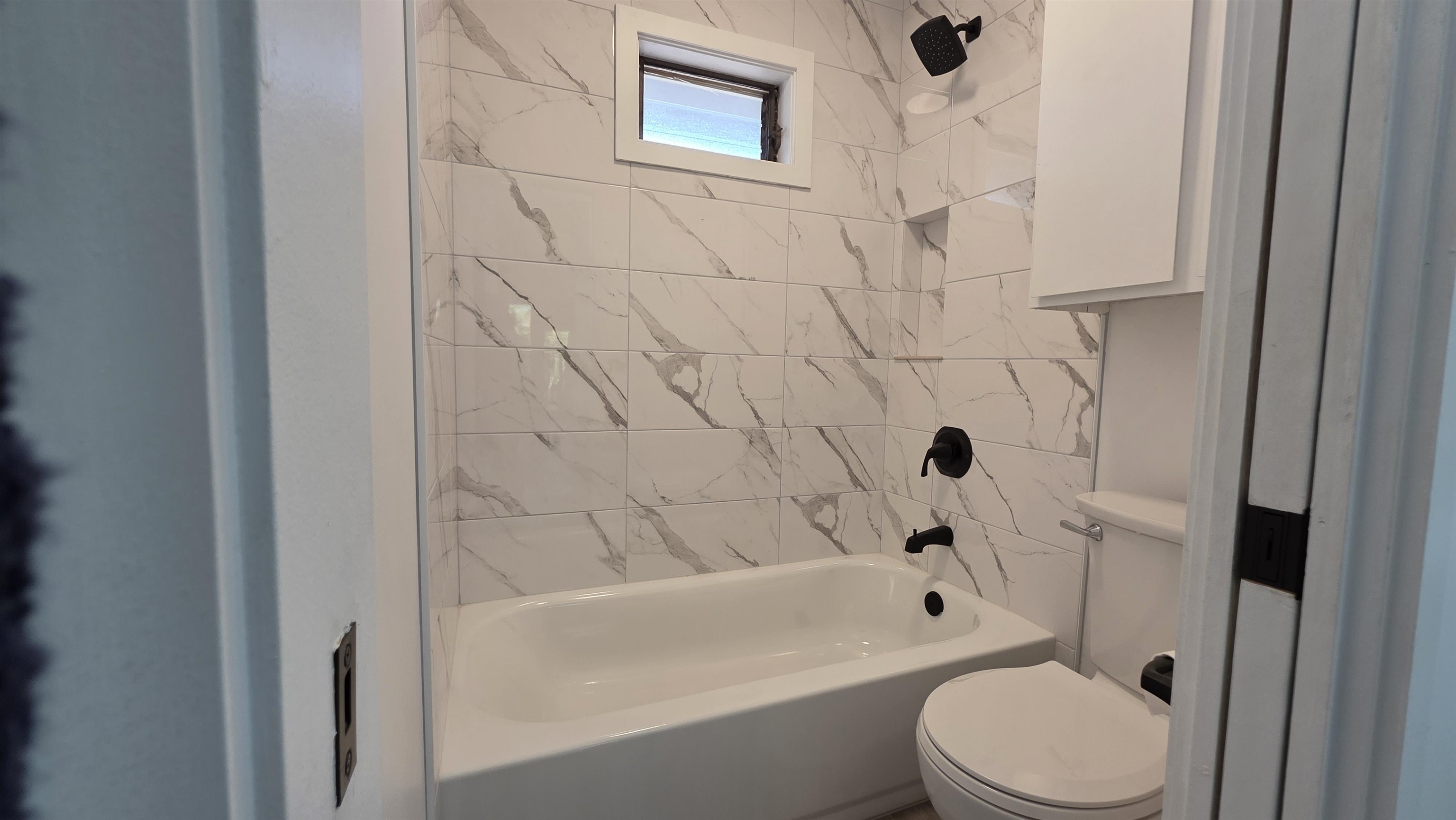 3788 Lower Honoapiilani Road, Unit A210 Lahaina, HI 96761 - Photo 20 of 21 a bathroom with a toilet and a bathtub