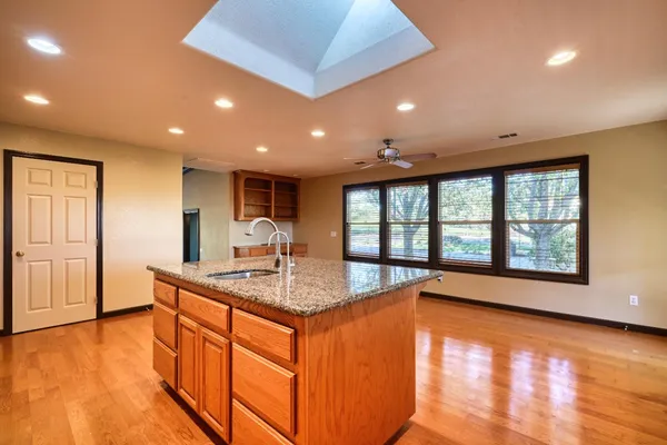 a bathroom with a sink a mirror and a shower