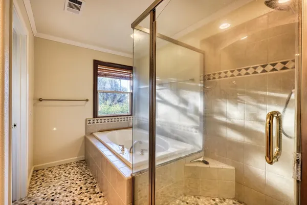 a large kitchen with a lot of counter space and stainless steel appliances