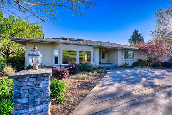 a view of a house with a big yard