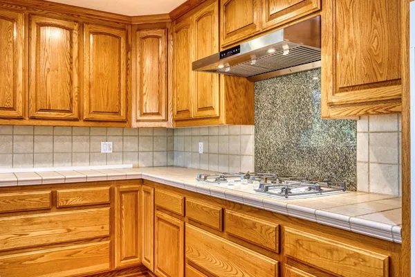 a view of house with outdoor space and swimming pool