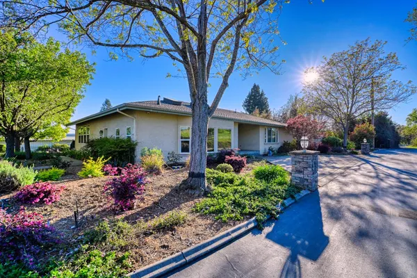 an aerial view of a houses with a lake view