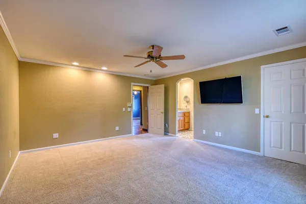 a kitchen with a sink a window cabinets and stainless steel appliances