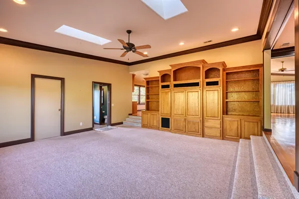 a bathroom with a sink double vanity granite tub shower and a mirror