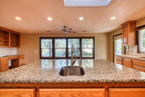 a bath tub sitting next to a window