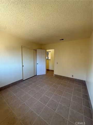 a view of a room with wooden cabinets