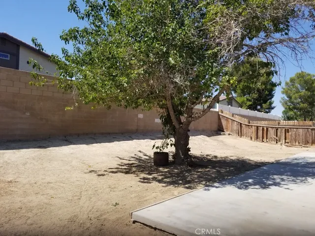a view of a backyard of the house