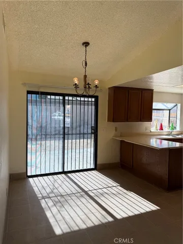 a kitchen with stainless steel appliances a refrigerator a stove top oven a sink and dishwasher