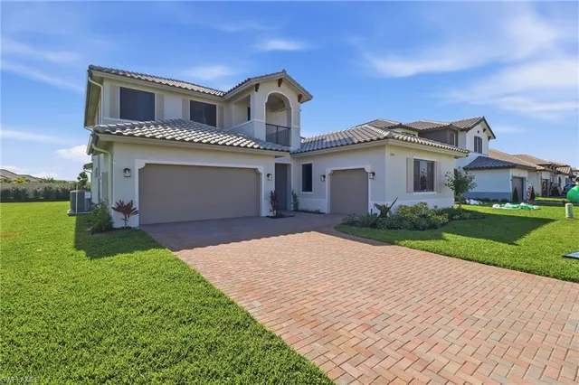 a front view of a house with yard