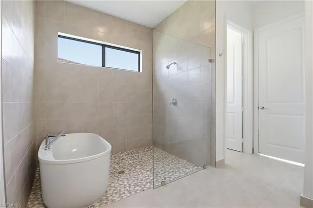 a bathroom with a bathtub and sink