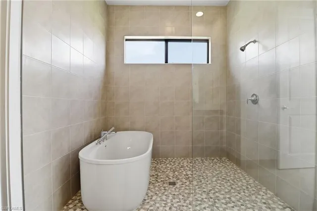 a bathroom with a toilet a sink and bathtub