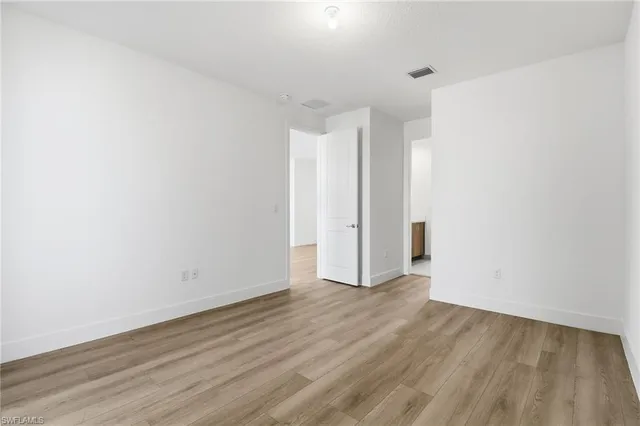 a bathroom with a toilet and bathtub