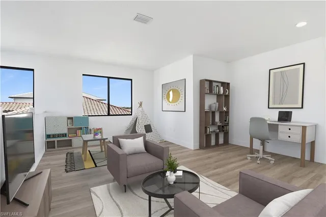 a living room with furniture and a table