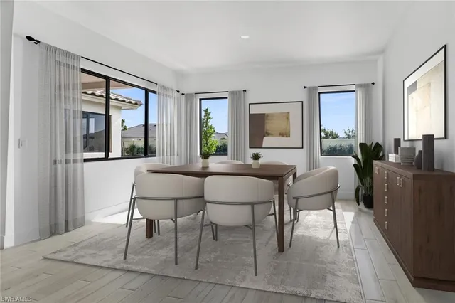 a view of a dining room with furniture and window