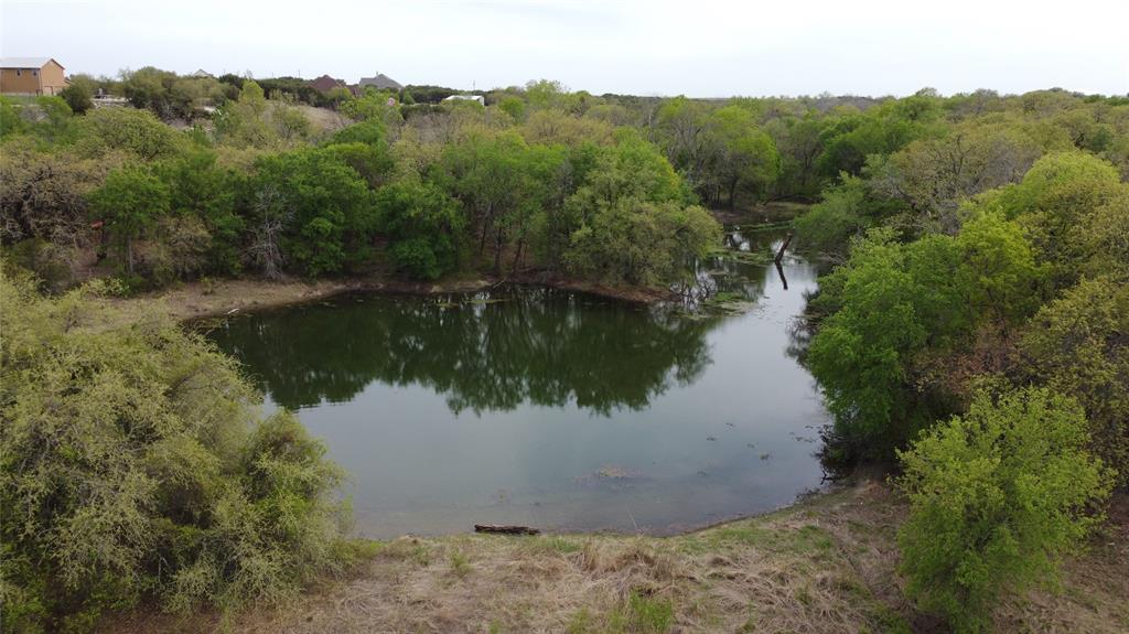 1033 Creek Crossing Road Nemo, TX 76070 - Photo 11 of 12 a view of a lake from a yard