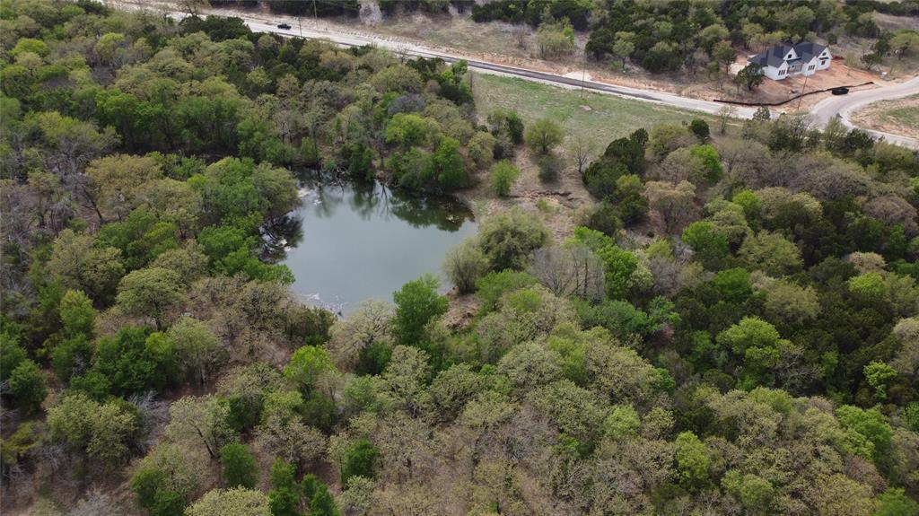 1033 Creek Crossing Road Nemo, TX 76070 - Photo 8 of 12 an aerial view of residential houses with outdoor space and trees
