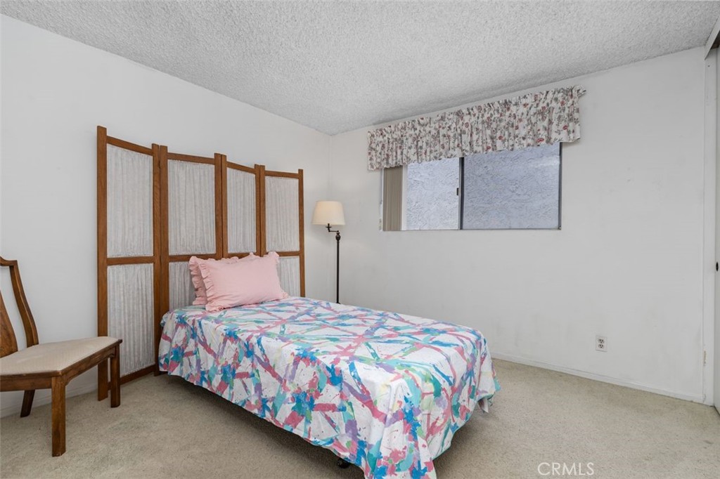 5081 Blackpool Road Westminster, CA 92683 - Photo 19 of 45 a bedroom with a bed and a dresser