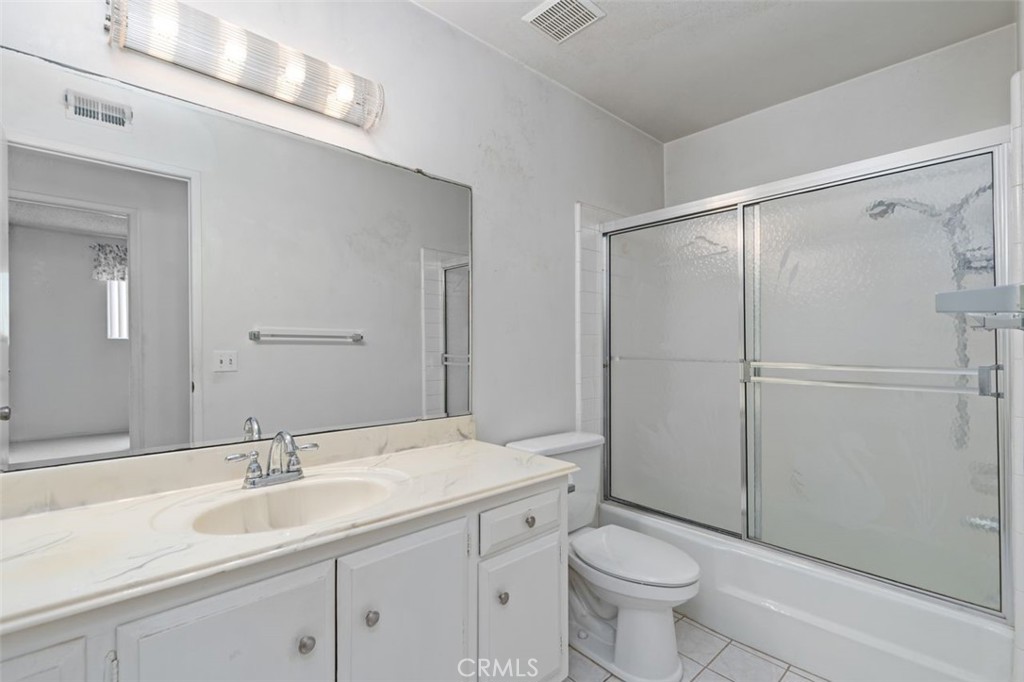 5081 Blackpool Road Westminster, CA 92683 - Photo 20 of 45 a bathroom with a sink toilet and shower
