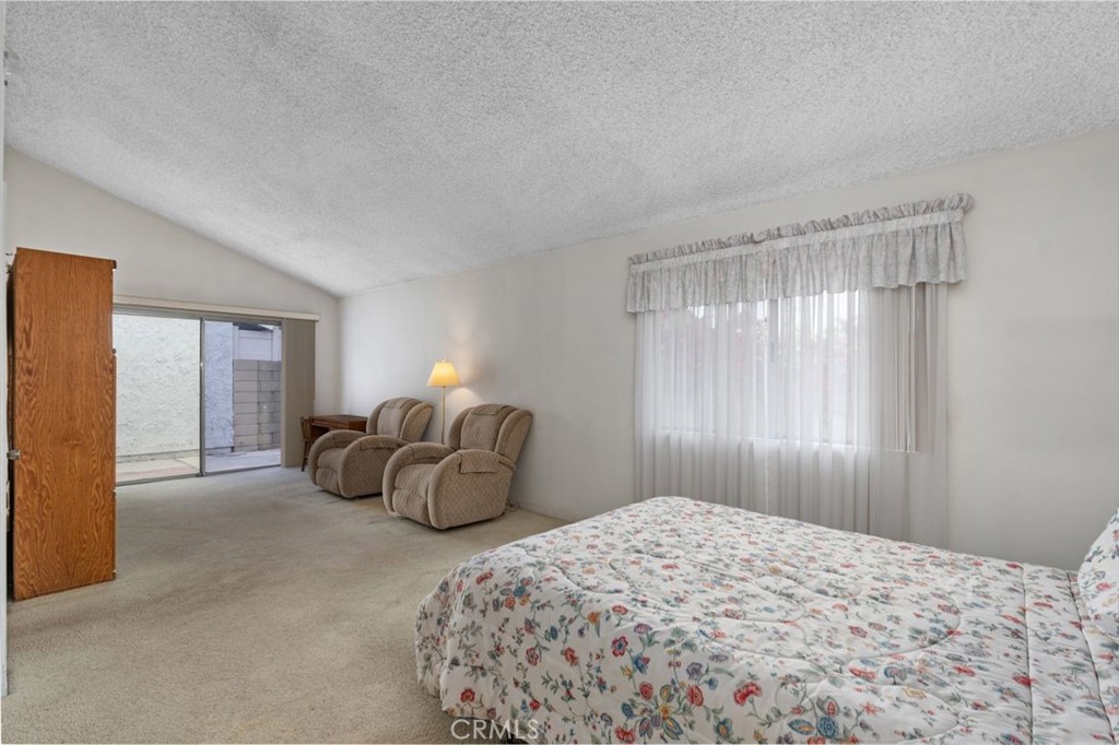 5081 Blackpool Road Westminster, CA 92683 - Photo 21 of 45 a bedroom with a bed and a window