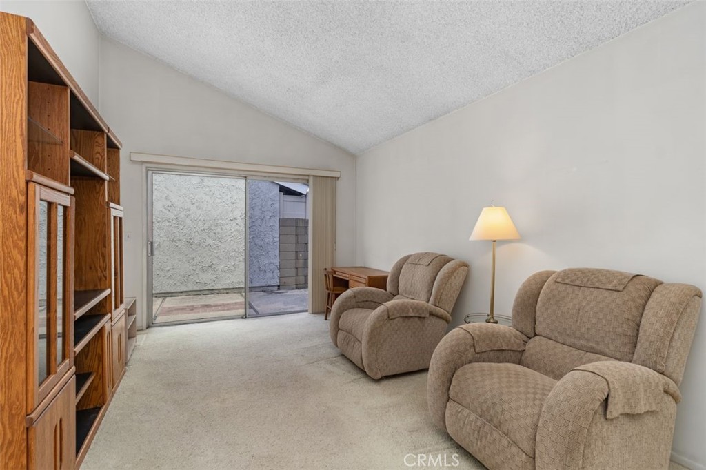 5081 Blackpool Road Westminster, CA 92683 - Photo 23 of 45 a living room with furniture and a flat screen tv