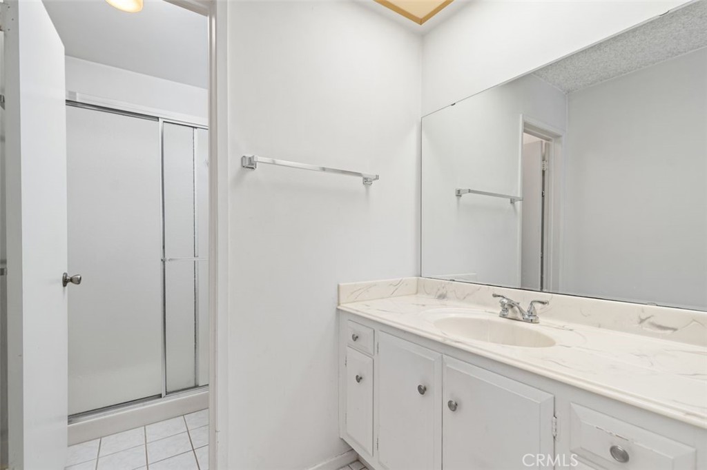 5081 Blackpool Road Westminster, CA 92683 - Photo 25 of 45 a bathroom with a sink and a mirror