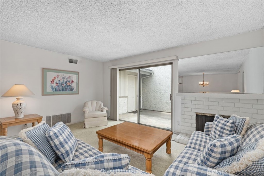 5081 Blackpool Road Westminster, CA 92683 - Photo 9 of 45 a living room with furniture and a fireplace
