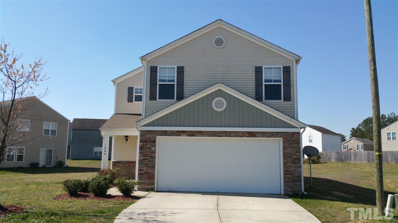 1004 Naylor Road Knightdale, NC 27545 - Photo 1 of 20 a front view of a house with a yard
