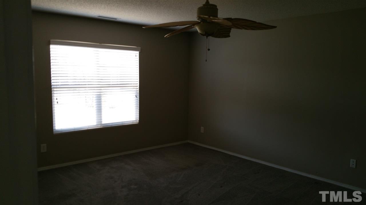1004 Naylor Road Knightdale, NC 27545 - Photo 14 of 20 a view of an empty room and a window