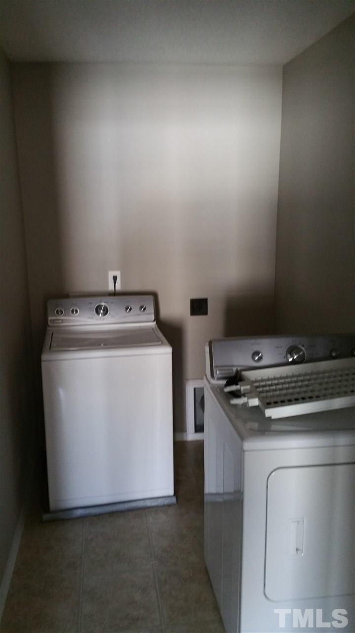 1004 Naylor Road Knightdale, NC 27545 - Photo 16 of 20 a utility room with washer and dryer