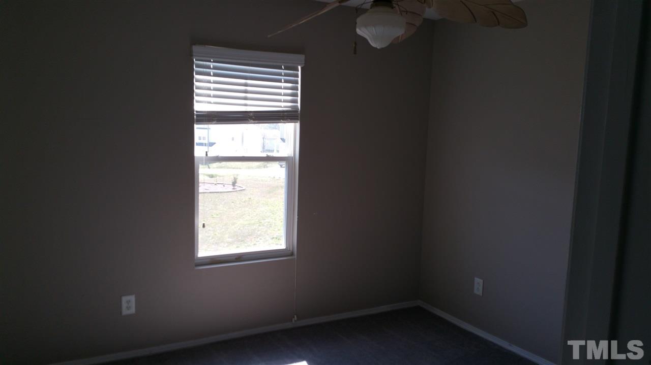 1004 Naylor Road Knightdale, NC 27545 - Photo 17 of 20 a view of an empty room with a window