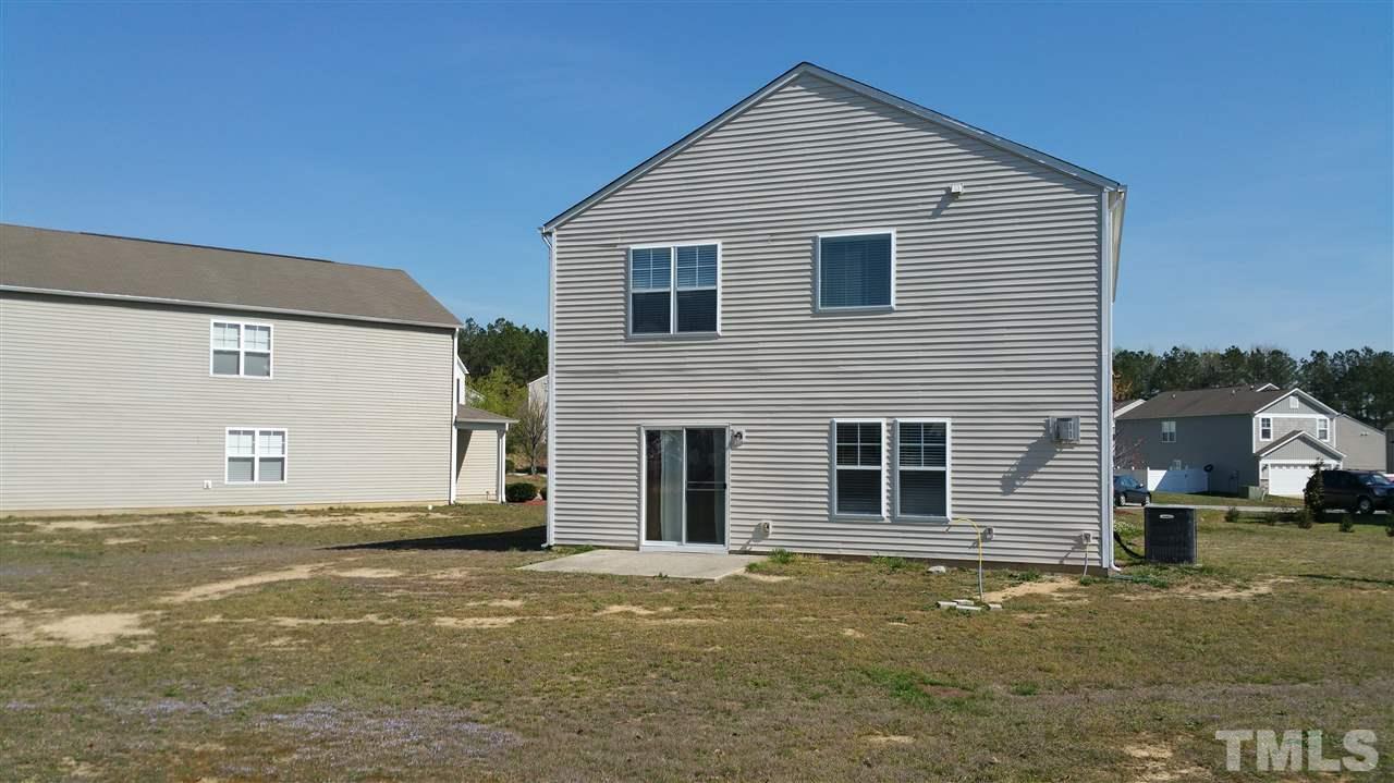 1004 Naylor Road Knightdale, NC 27545 - Photo 19 of 20 a view of a house with a yard