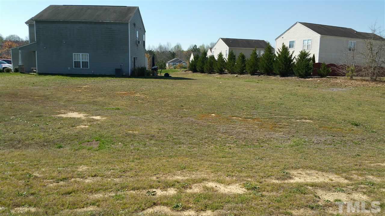 1004 Naylor Road Knightdale, NC 27545 - Photo 20 of 20 a view of a field with an house in background