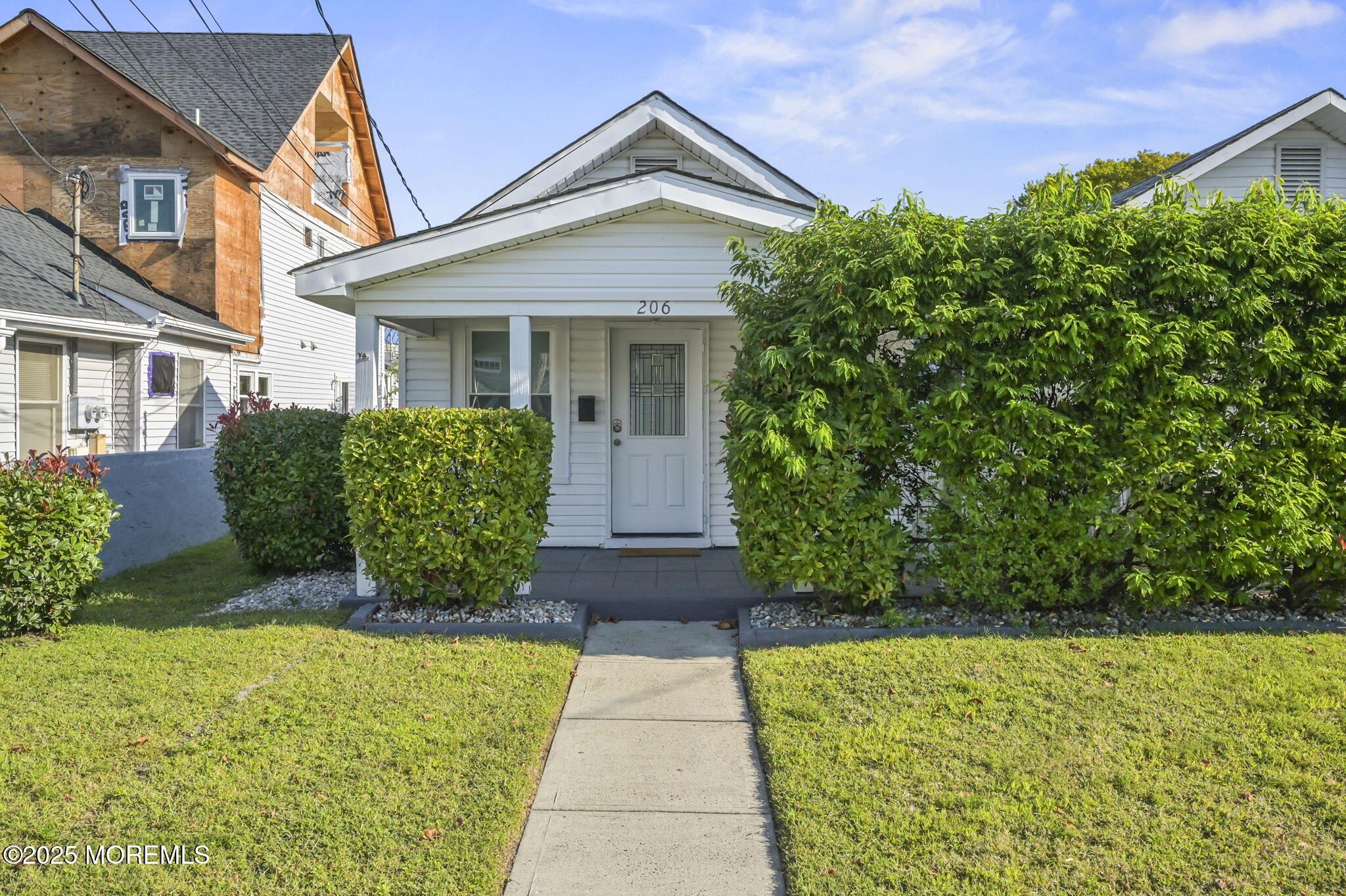 206 16th Avenue Belmar, NJ 07719 - Photo 1 of 20 a front view of a house with garden