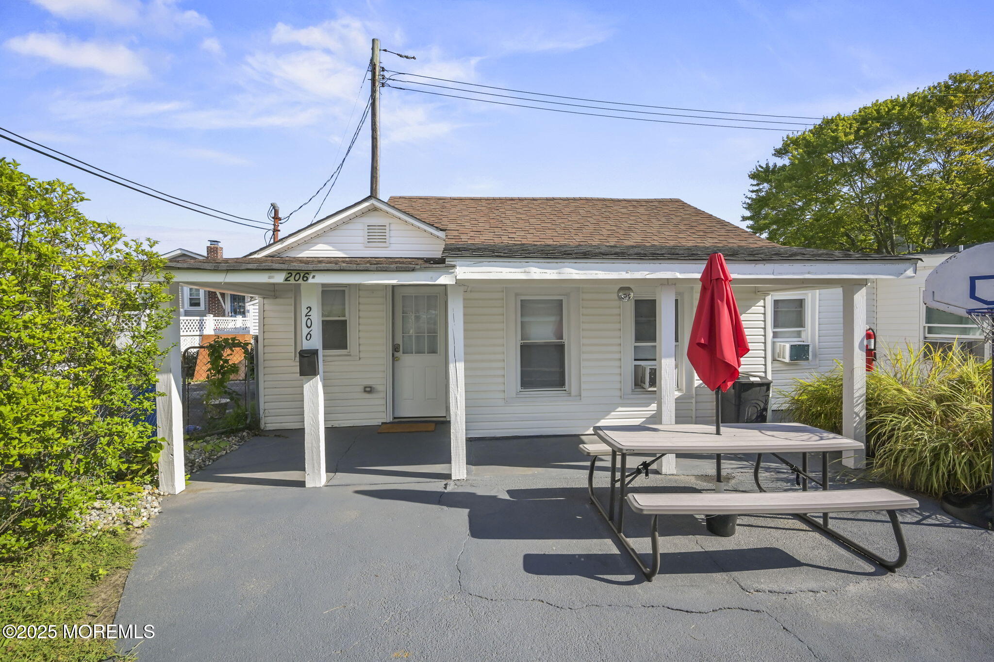 206 16th Avenue Belmar, NJ 07719 - Photo 11 of 20 a patio with sofas table and chairs