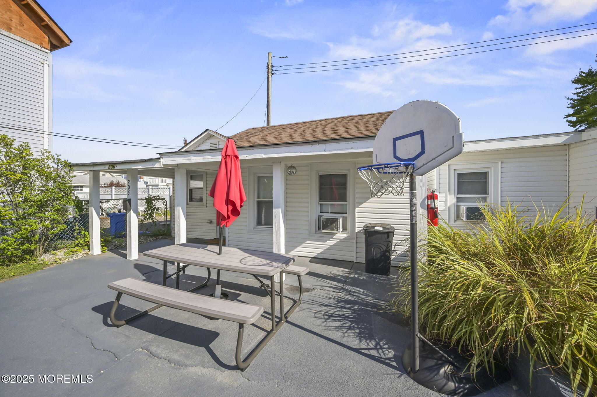 206 16th Avenue Belmar, NJ 07719 - Photo 12 of 20 a view of a lounge chairs in the patio