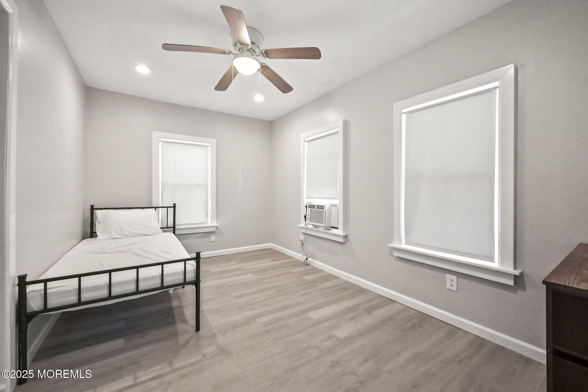 206 16th Avenue Belmar, NJ 07719 - Photo 14 of 20 a bedroom with a bed and a window