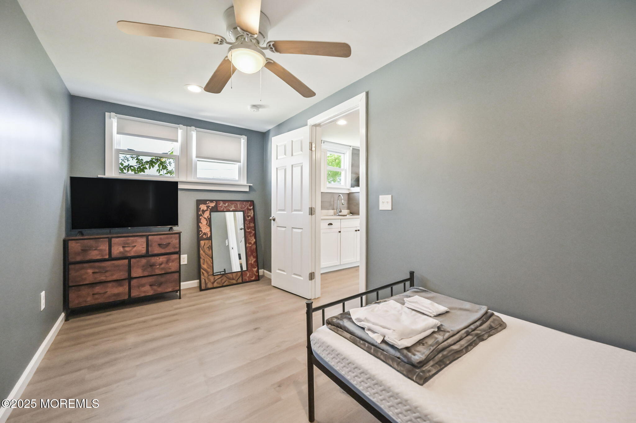 206 16th Avenue Belmar, NJ 07719 - Photo 18 of 20 a living room with furniture and a flat screen tv