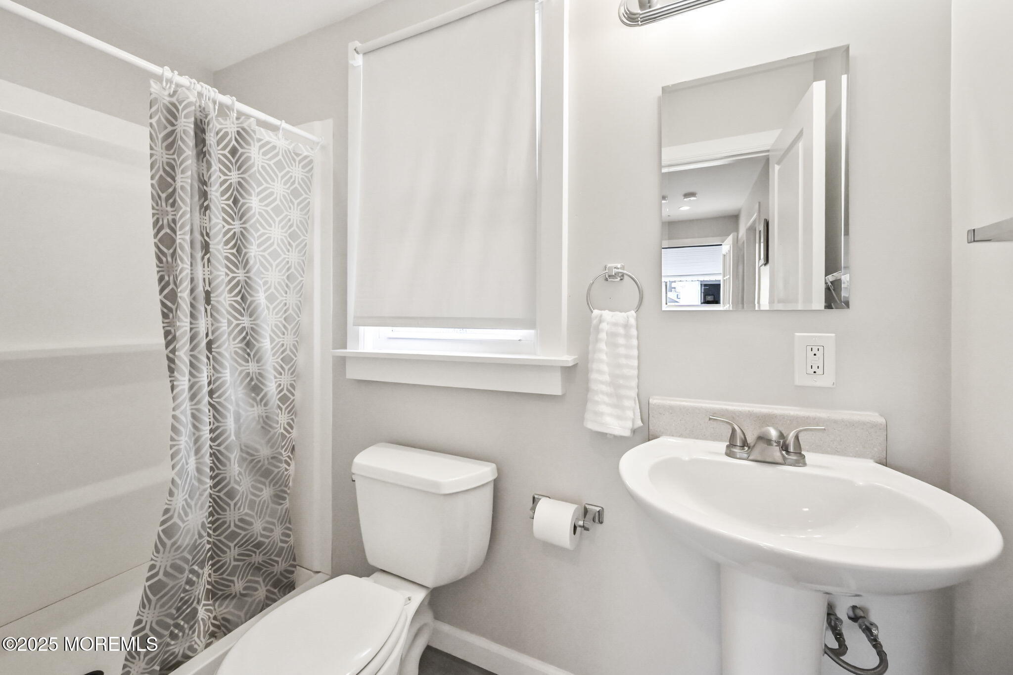 206 16th Avenue Belmar, NJ 07719 - Photo 20 of 20 a bathroom with a sink toilet and a mirror