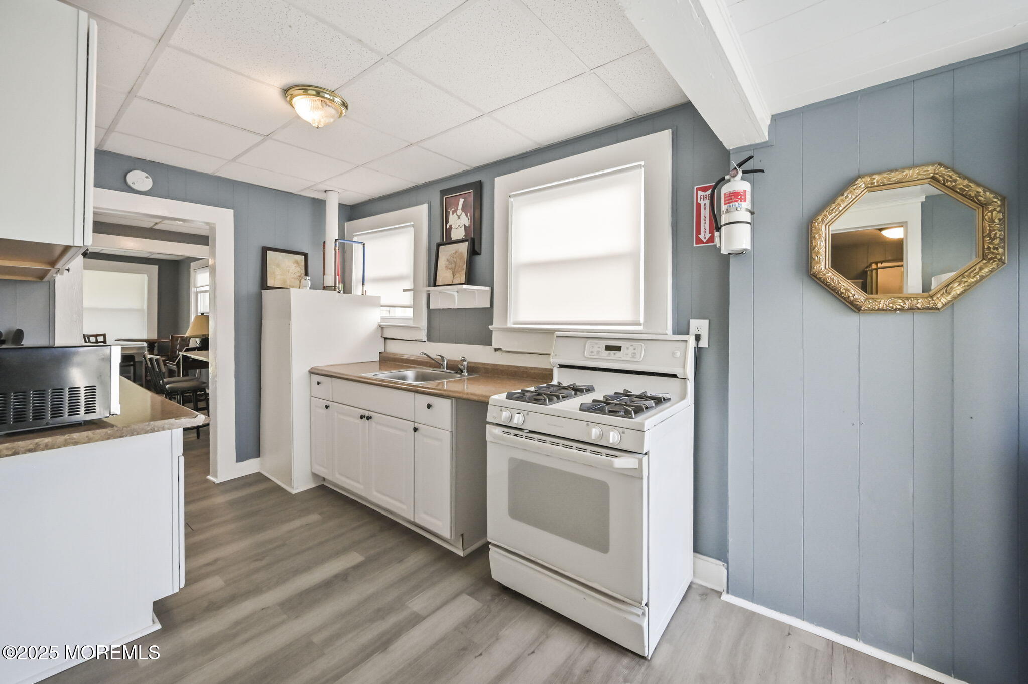 206 16th Avenue Belmar, NJ 07719 - Photo 7 of 20 a kitchen with a stove oven and sink